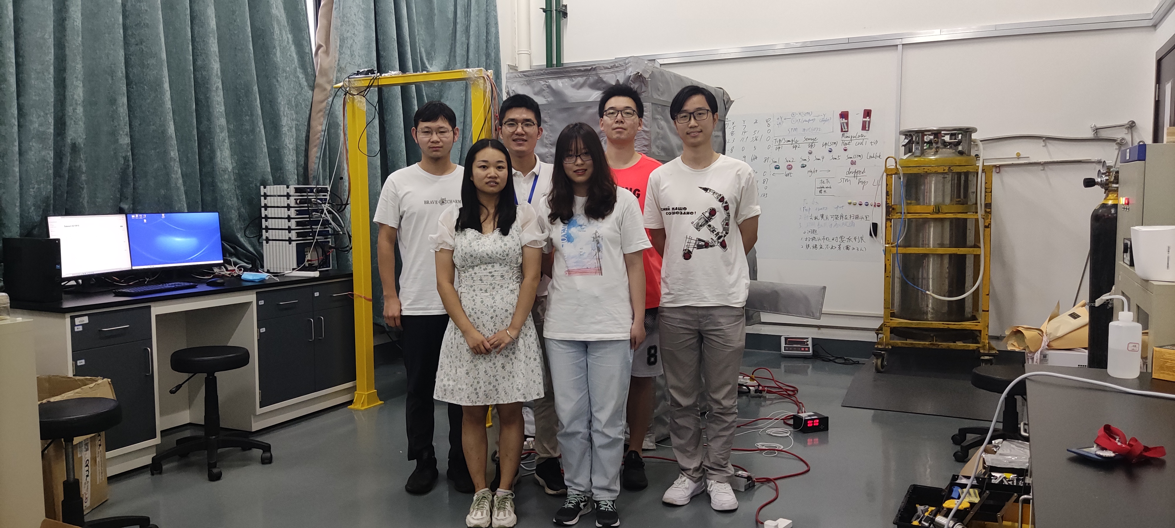 Group picture with microscope
